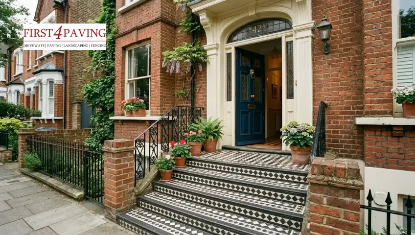 Victorian geometric tiled front door steps with classic black and white patterns on a UK terrace home 