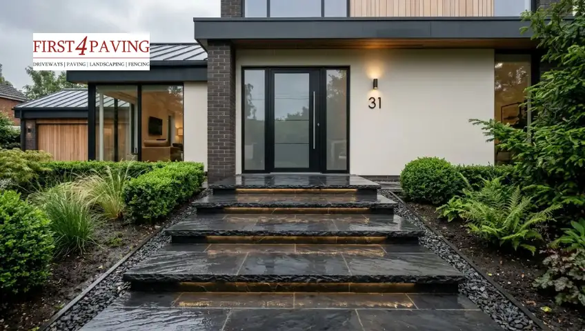 Dark slate front door steps with natural texture, creating a sleek modern entrance for a UK home 