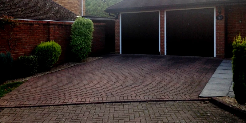 Block paving driveway installation in Enfield UK with durable interlocking brick pattern.
