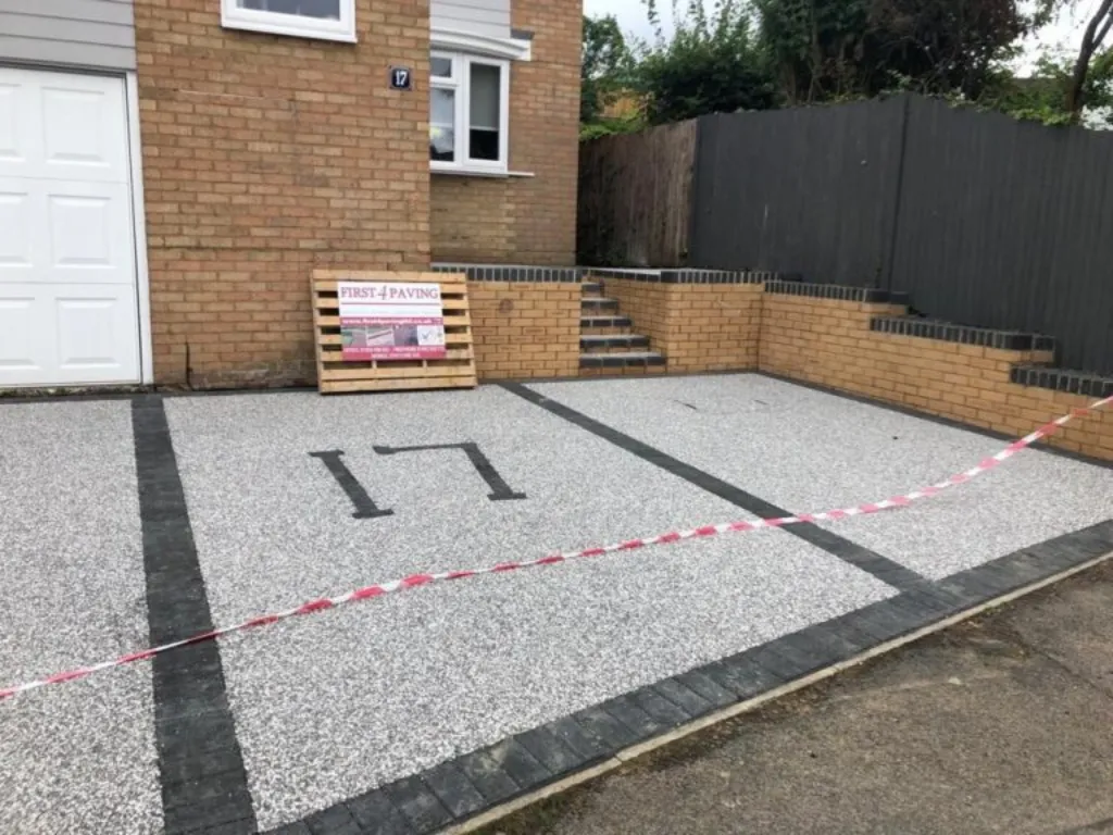 Driveways in Enfield modern resin driveway installation with black block borders and custom house number detailing