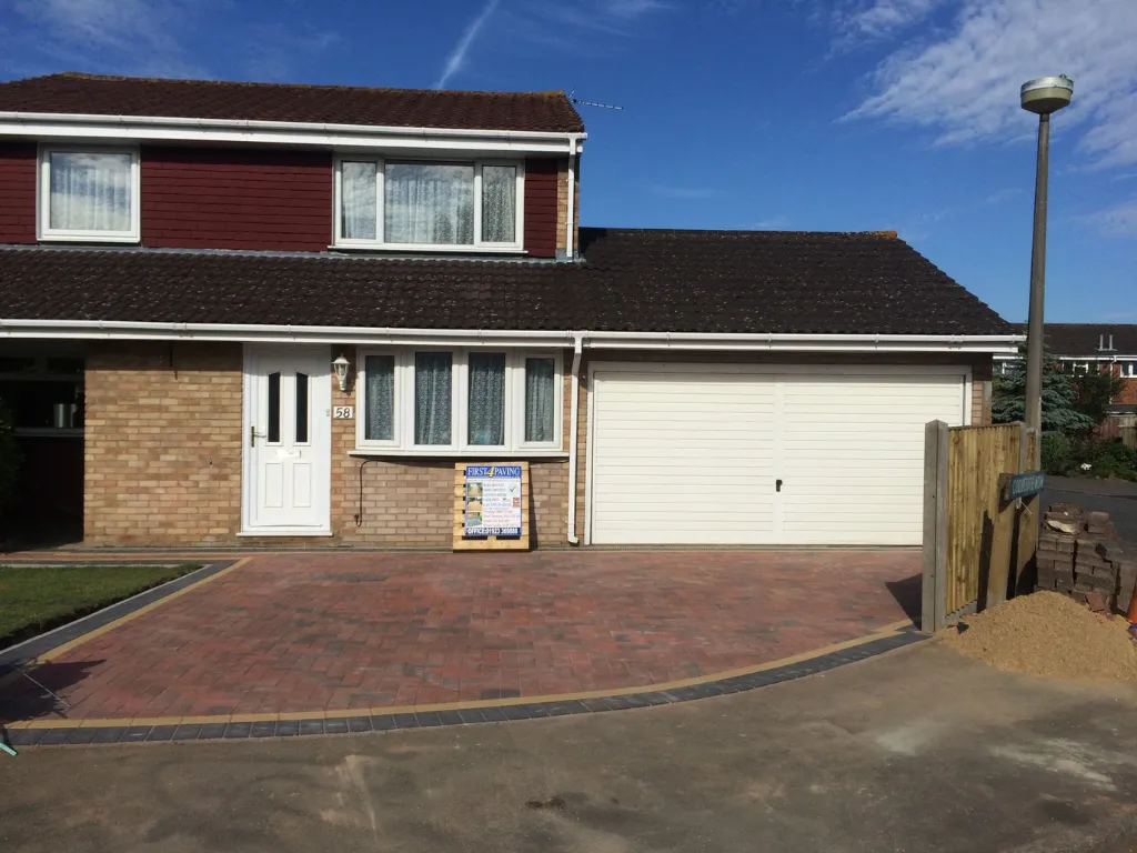 Driveways in Hertfordshire block paving driveway installation with a neat dark border outside a residential home