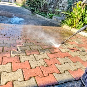 First4Paving driveway cleaning experts in Enfield removing dirt, moss, and surface buildup from outdoor driveways